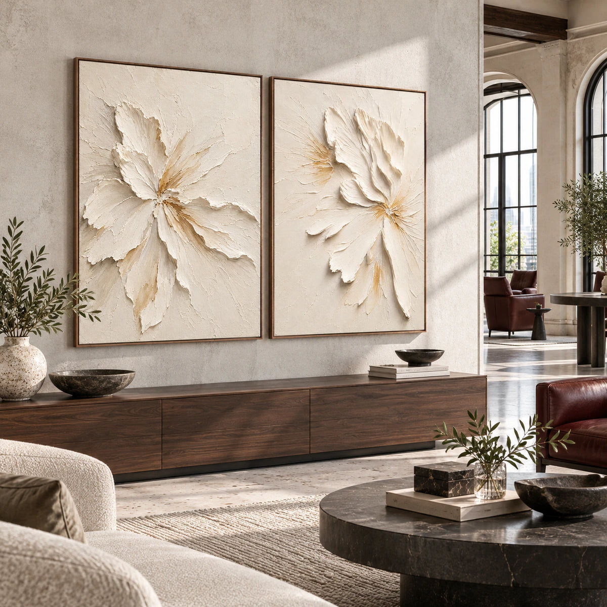 Open hospitality loft interior centered on the Alabaster-Petals floral diptych.