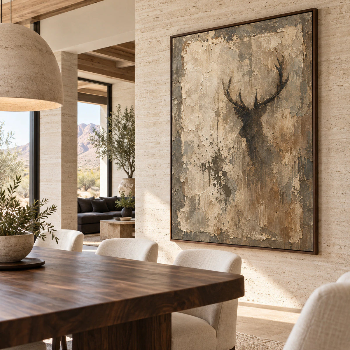 Textured stag silhouette artwork in a refined daylight dining room.