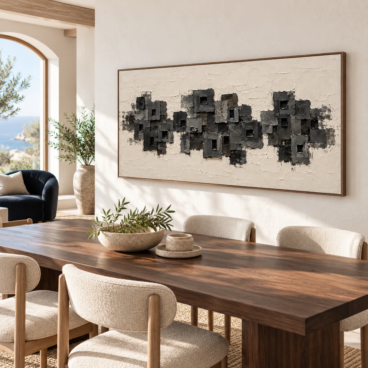 Panoramic textured artwork anchoring a refined dining room with a long table and restrained furnishings.