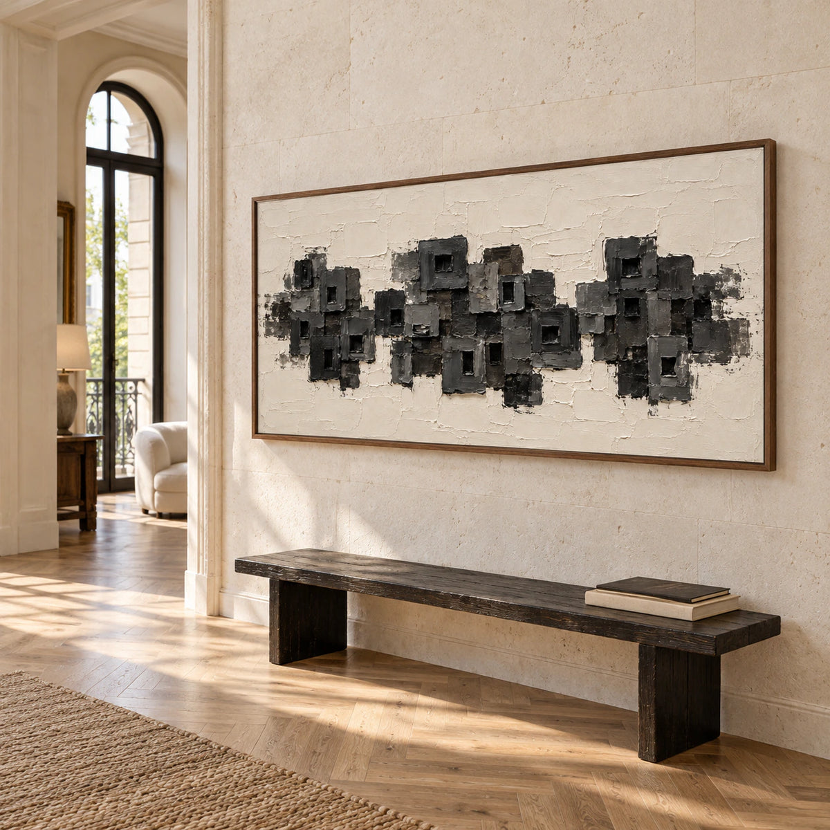 Panoramic charcoal and ivory artwork commanding a bright gallery-scale foyer.