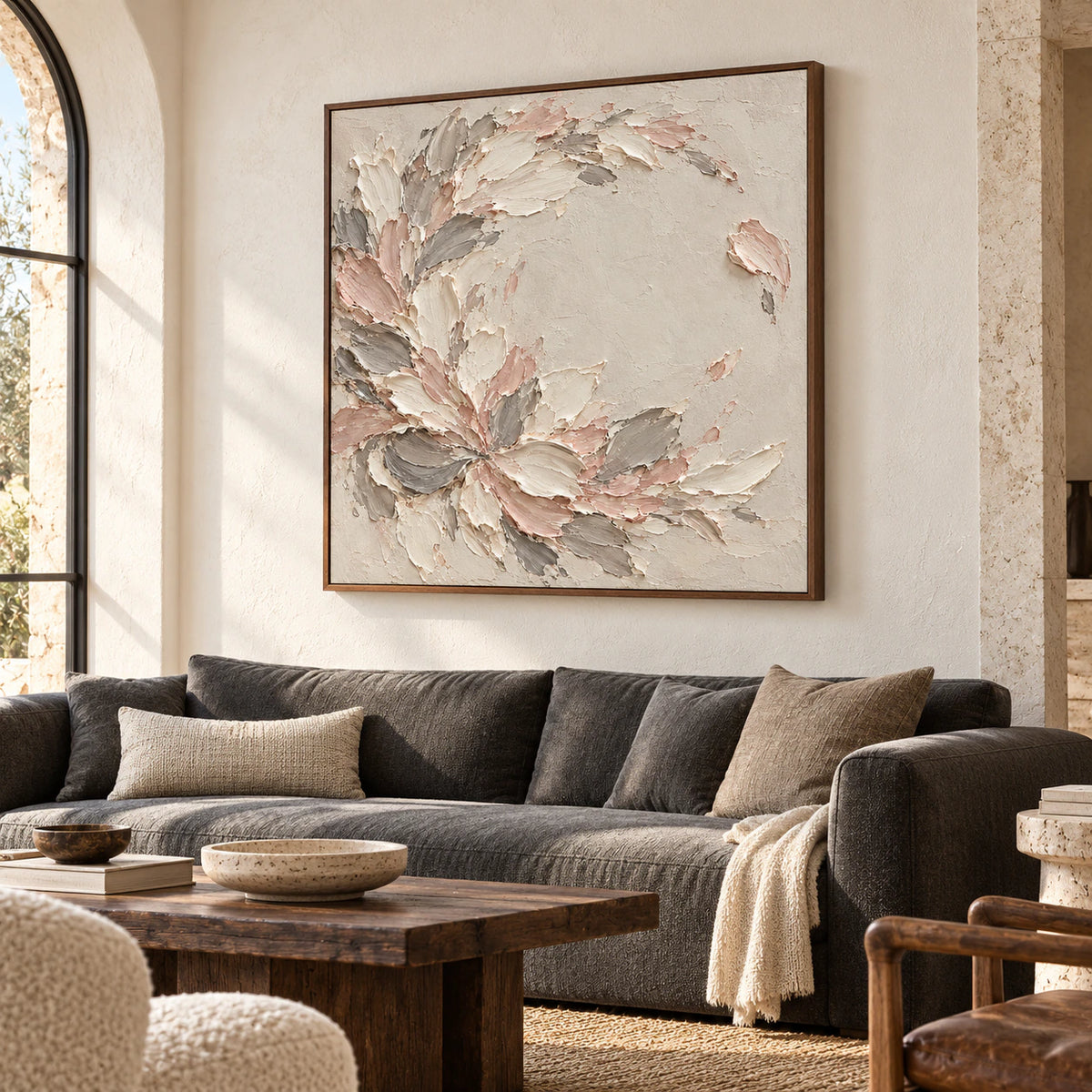 Blush-Scatter artwork above a charcoal sofa in a bright living room with natural daylight.