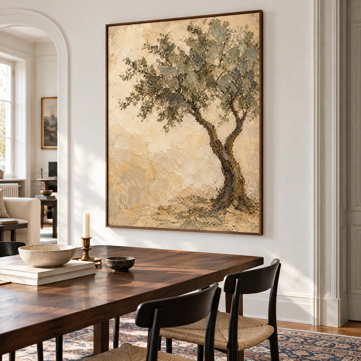 Vertical tree painting above a dark walnut dining table with slim black chairs and a cool white wall, viewed from the right in natural daylight.