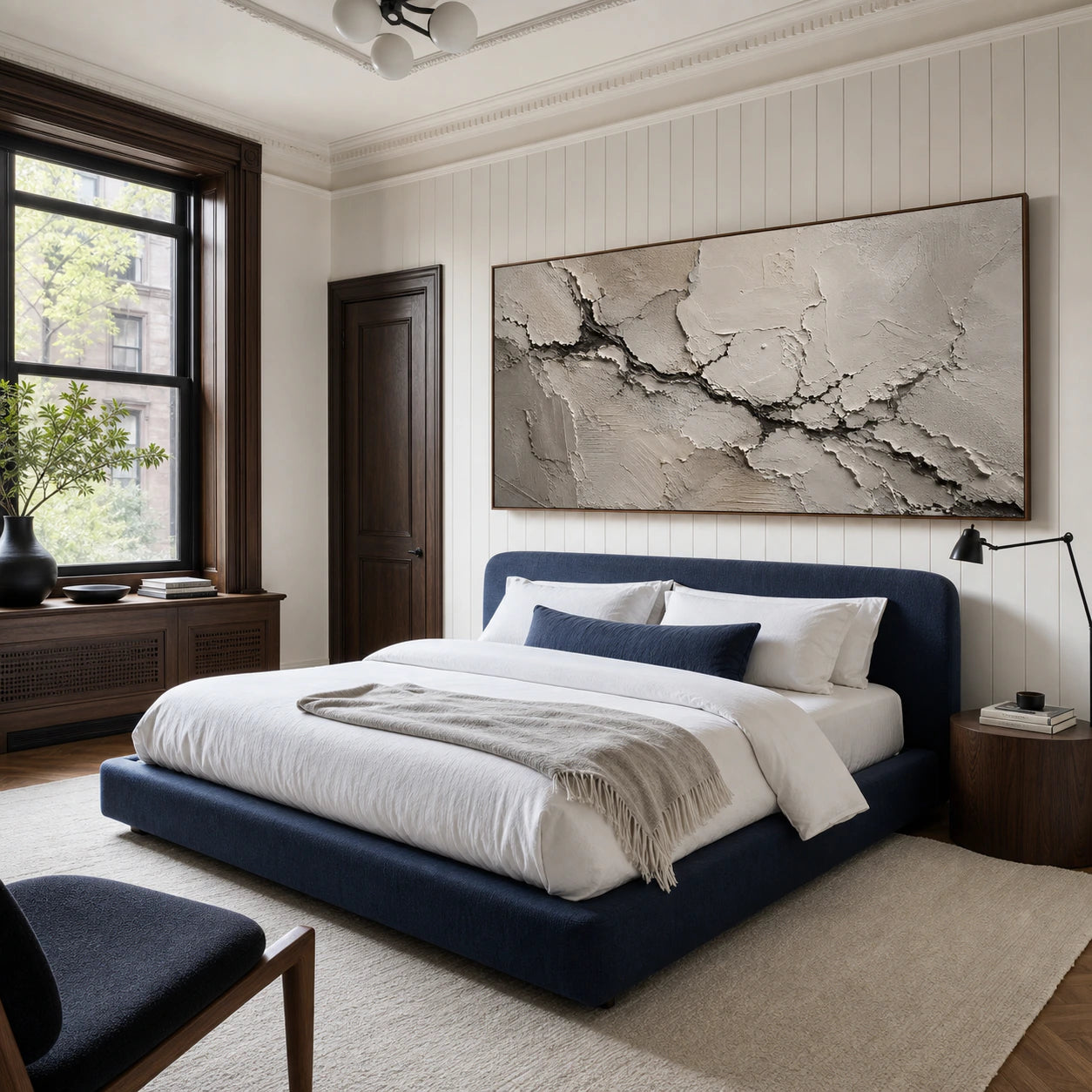 Wide Calcite-Rift painting above an indigo bed in a quiet, naturally lit bedroom.