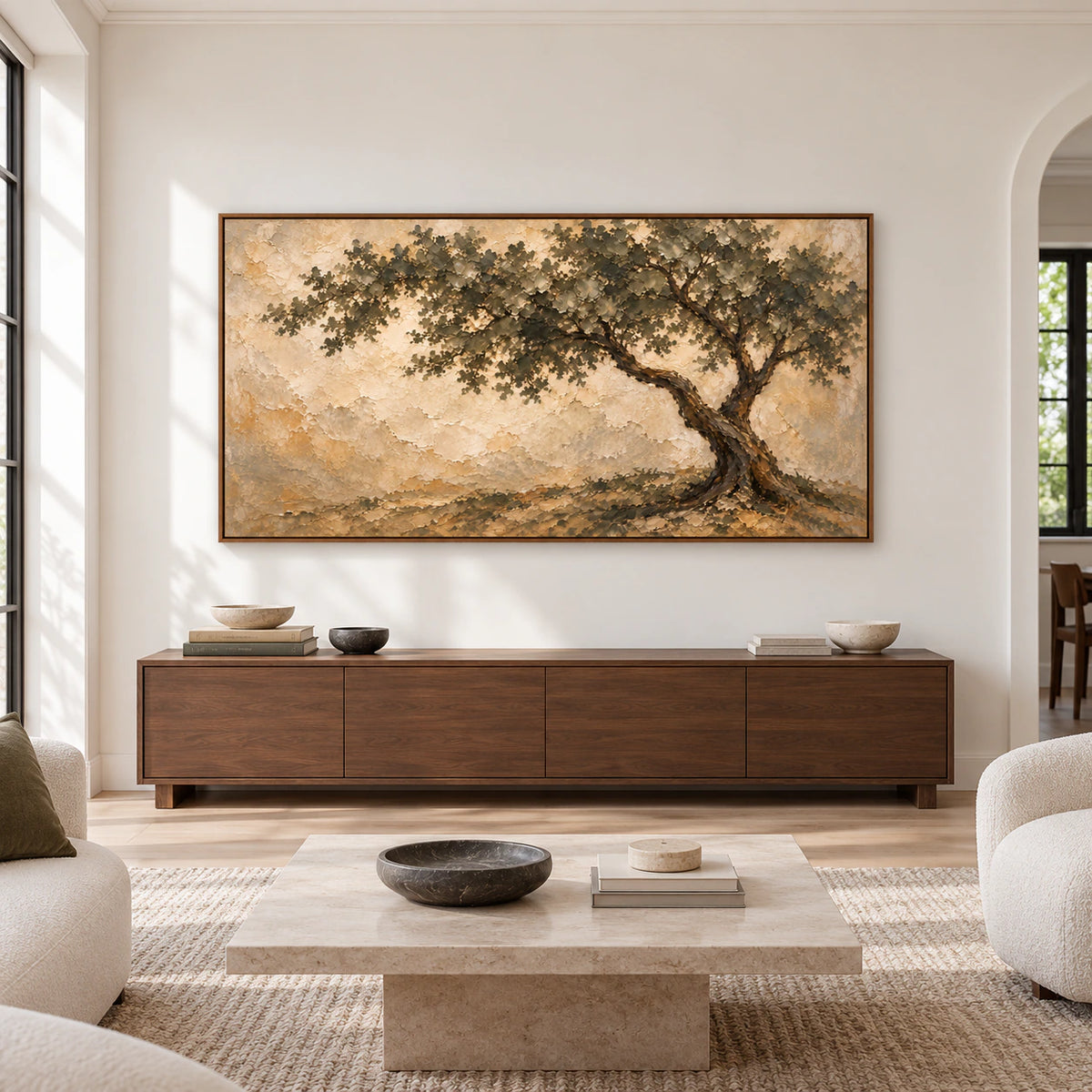 Large horizontal tree painting displayed straight-on above a low console in a spacious, softly lit living room.