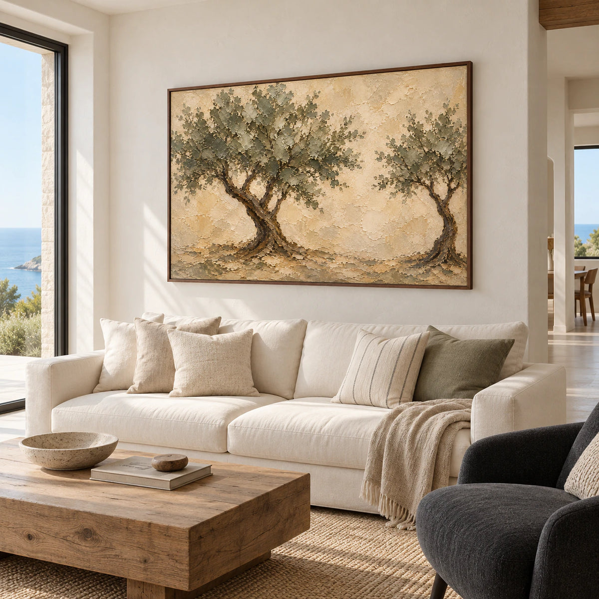 Canopy-Interval painting above a low ivory sofa in a bright living room with pale plaster walls and a charcoal chair, viewed from the left.