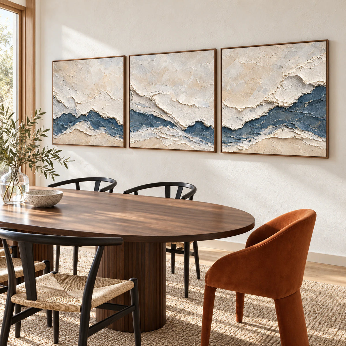 Cerulean-Sediment triptych in a refined daylight dining room.