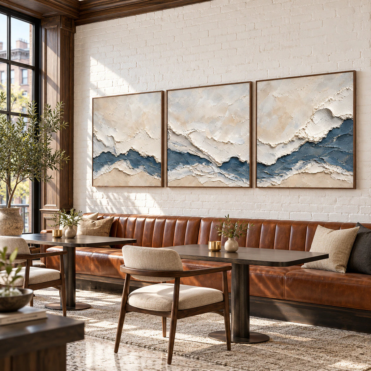 Cerulean-Sediment triptych in an expansive daylight loft interior.