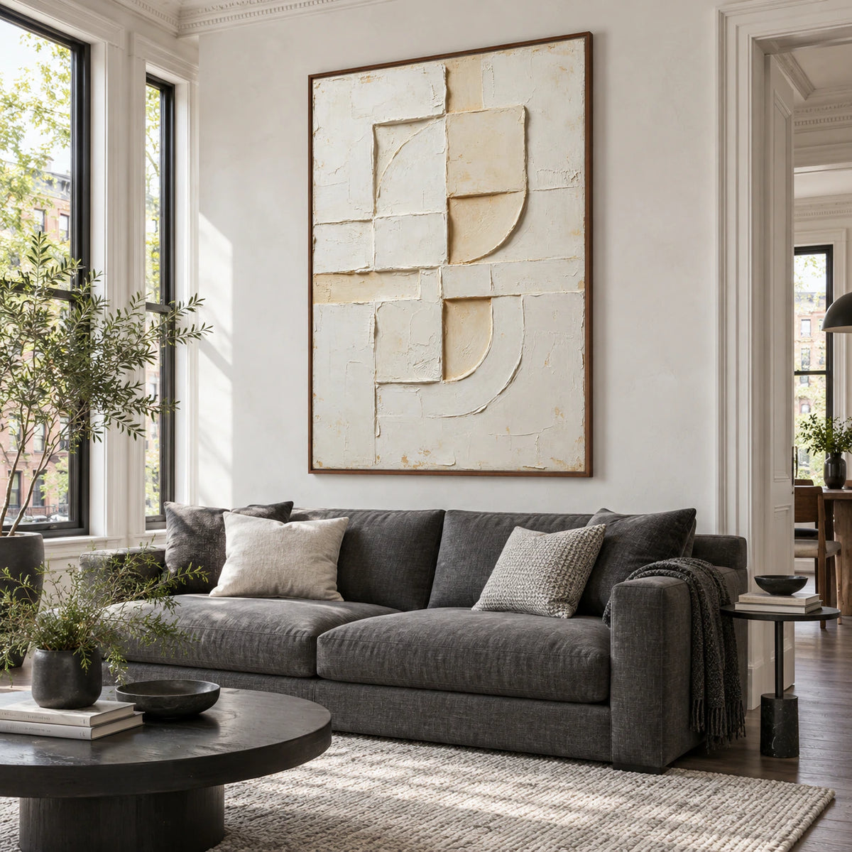 Chalk-Arc above a restrained sofa in a bright daylight-filled living room.