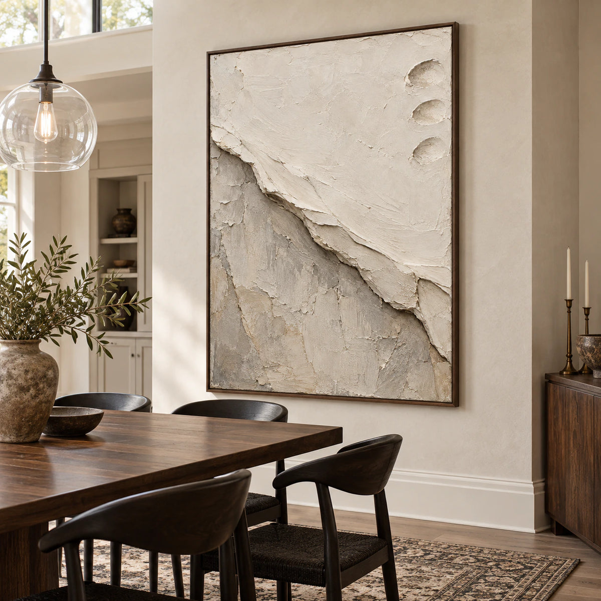 Vertical ivory and stone-grey abstract painting in a refined daylight dining room.