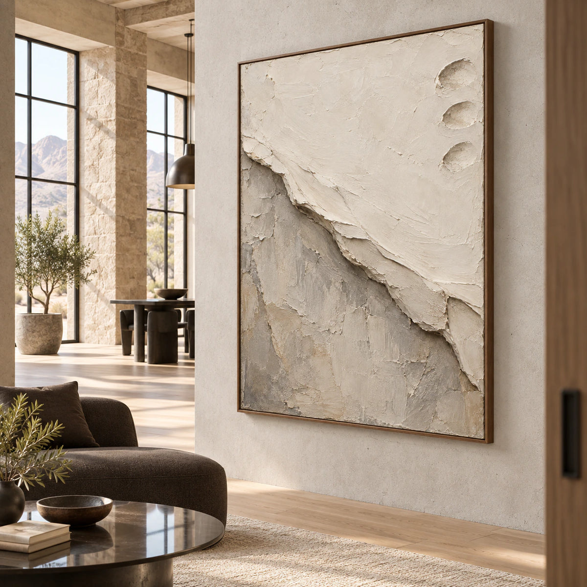 Large textured vertical abstract painting in an expansive daylight loft hospitality interior.
