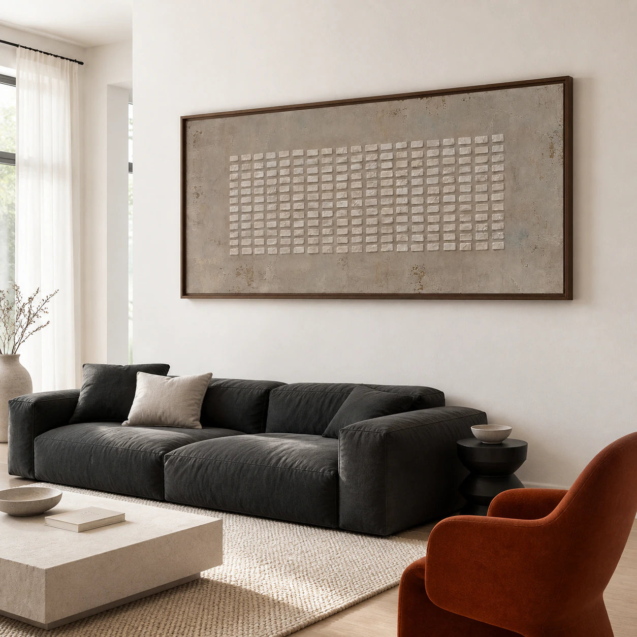 Chalk-Grid as the focal artwork above a restrained sofa in a bright living room.