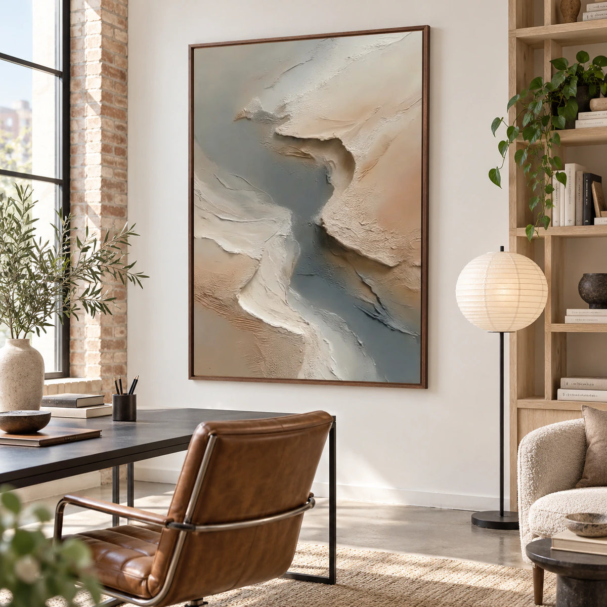 Airy reading space with the textured vertical painting as the dominant artwork beside a sculptural chair.