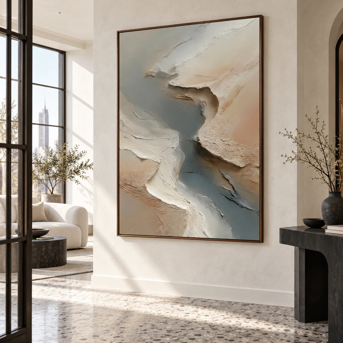 Gallery-scale foyer with the vertical ivory and slate-gray relief painting presented prominently on a pale wall.