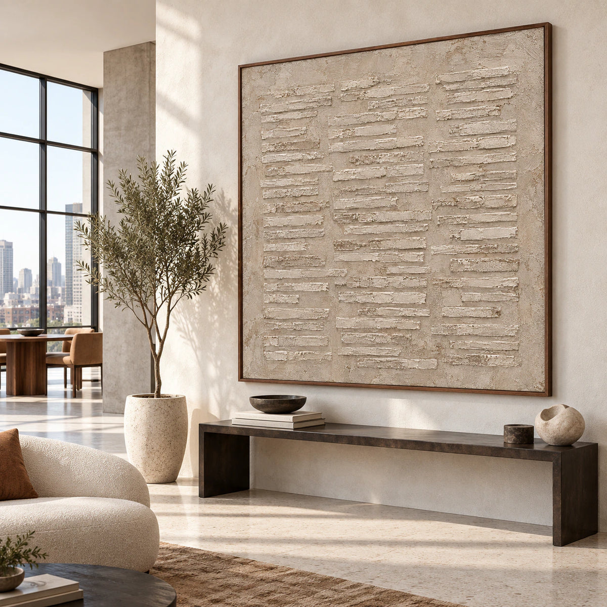 Large square relief painting displayed prominently in a daylight-filled gallery-scale foyer.