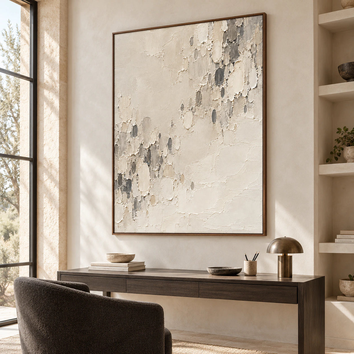 Chalk-Reliquary above a slim dark desk in an airy office with a reading chair, open shelving and a tall window, viewed from the left at standing eye level.