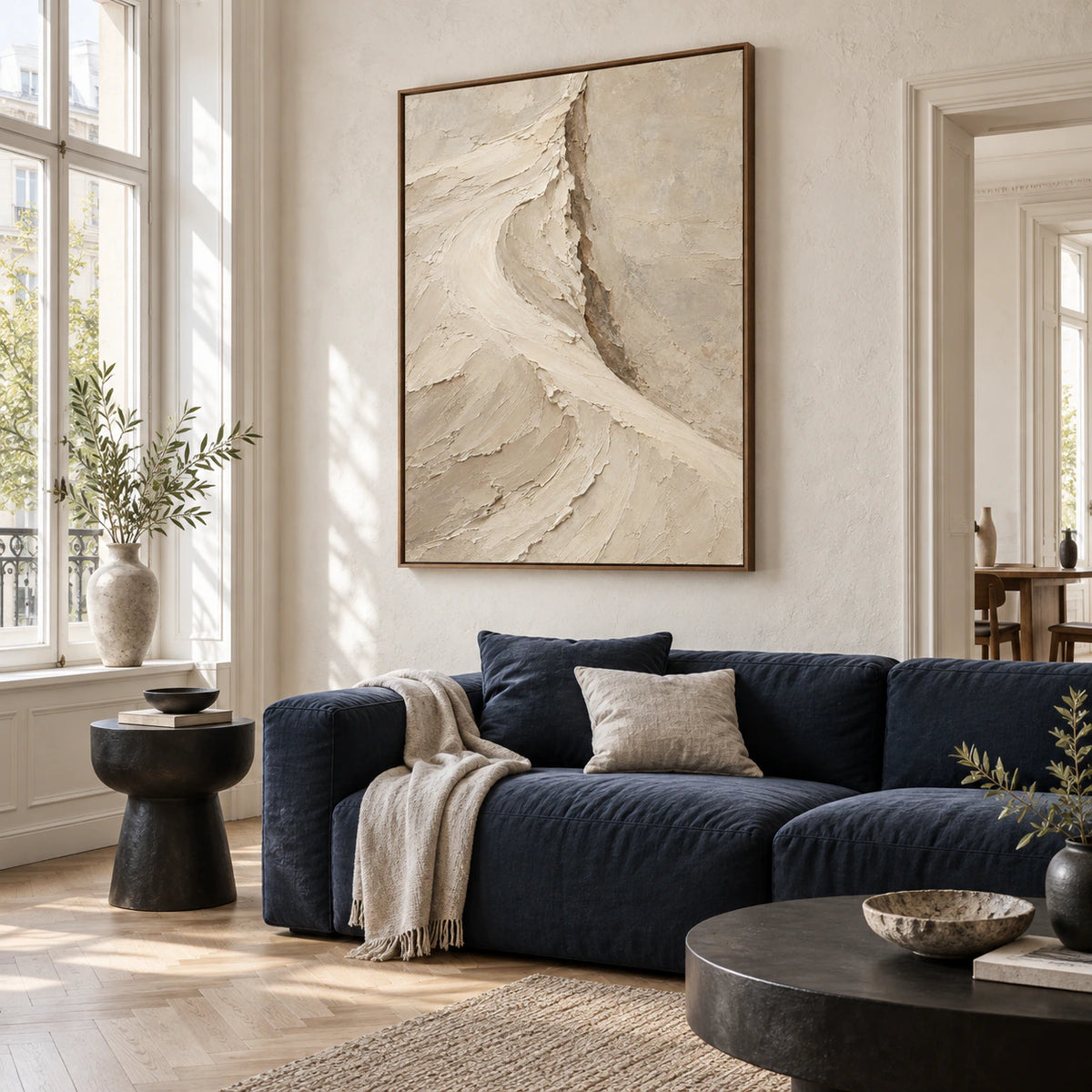 Chalk-Rift above a restrained sofa in a sunlit contemporary living room.
