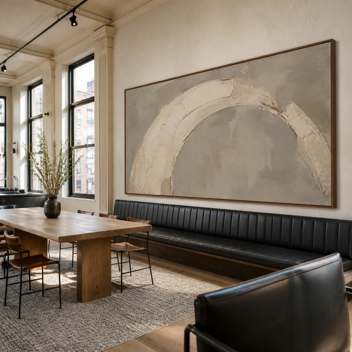 Expansive loft hospitality interior anchored by the large Chalk-Span painting.