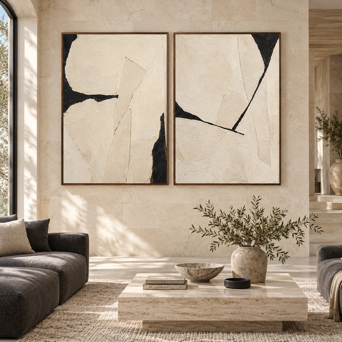 Large chalk-white and black textured abstract diptych in slim walnut frames, displayed straight-on in a spacious interior.