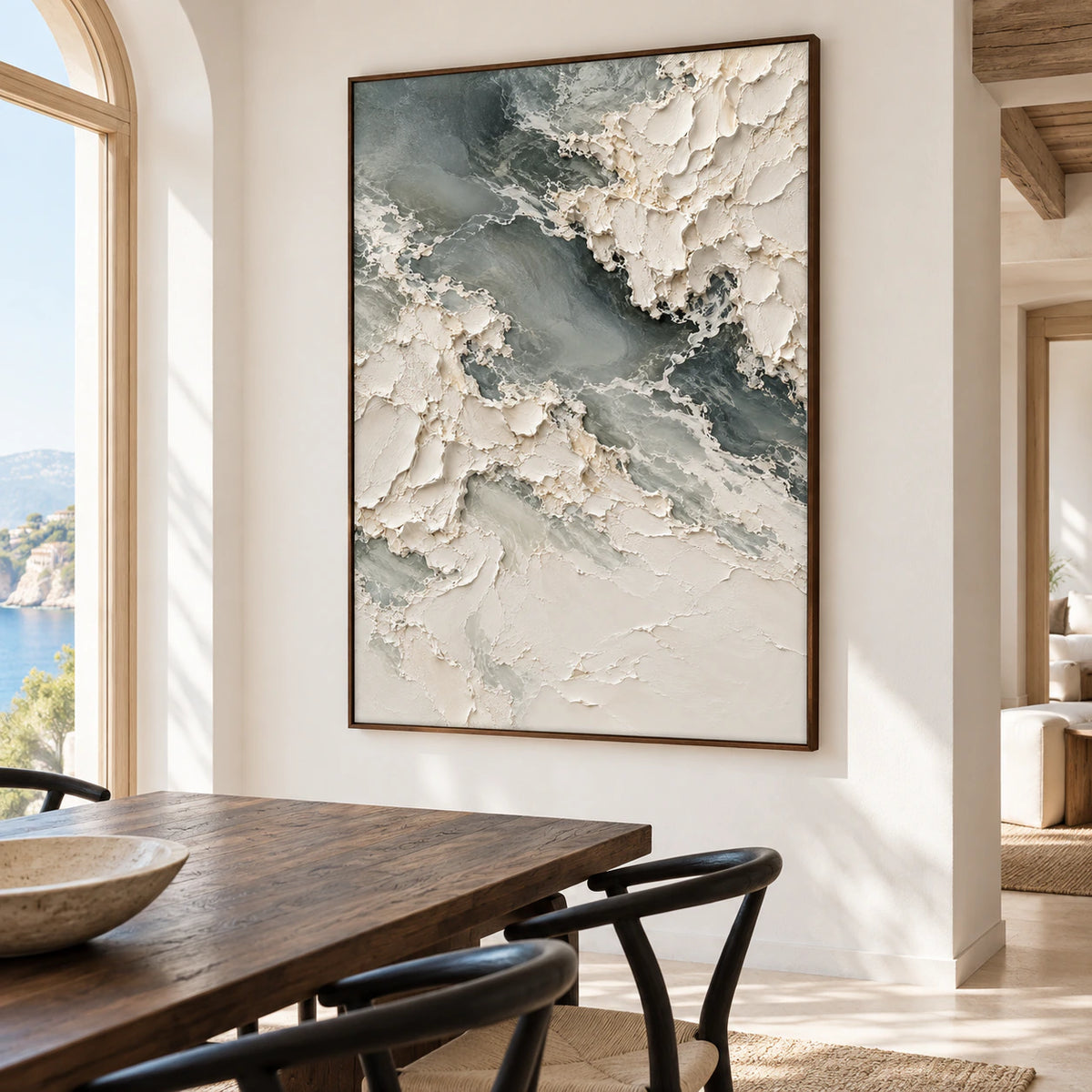 Chalkwater-Fold on a warm white dining room wall beside a long dark wood table and sculptural black chairs, viewed from the right.