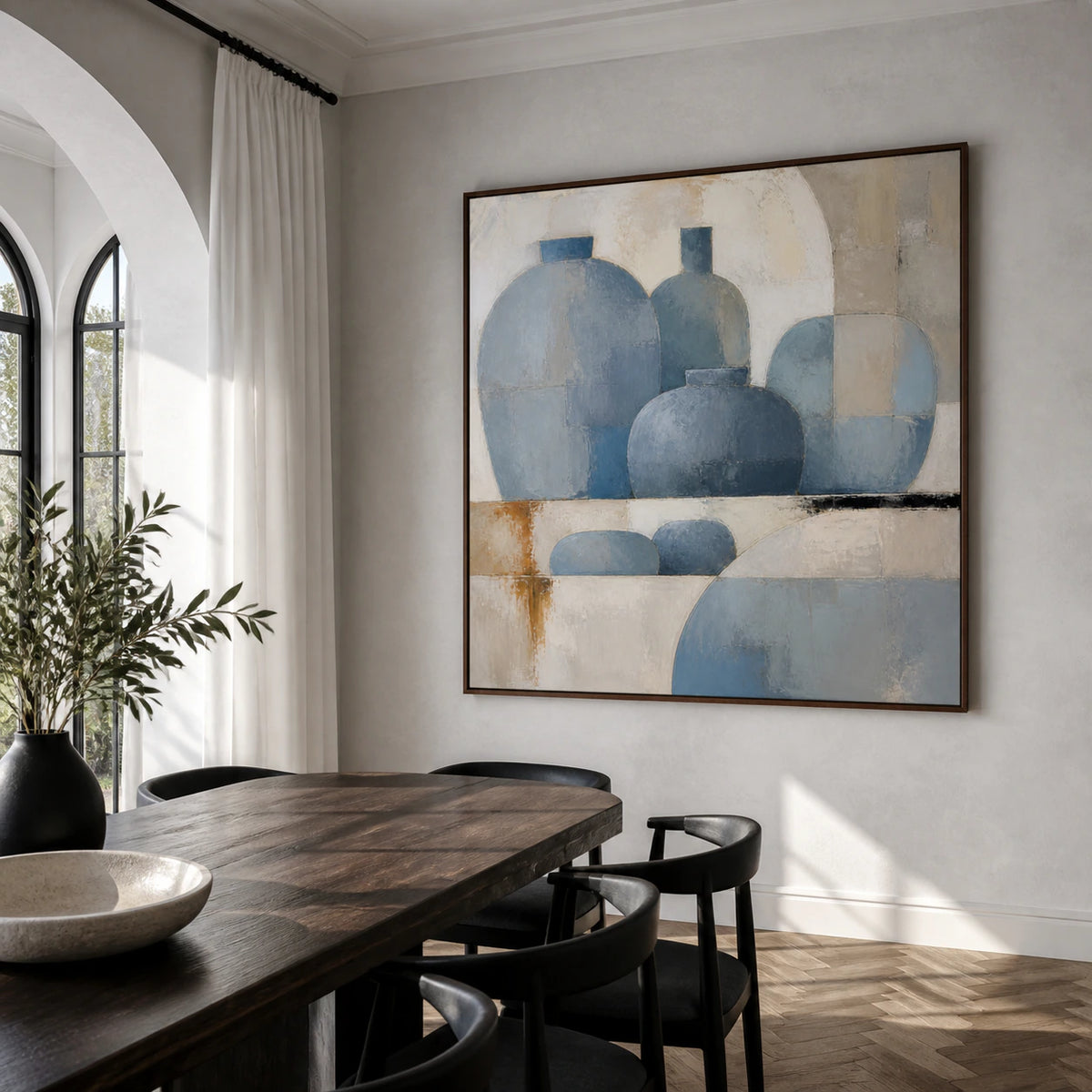 Square abstract vessel painting as the focal point of a refined daylight dining room.