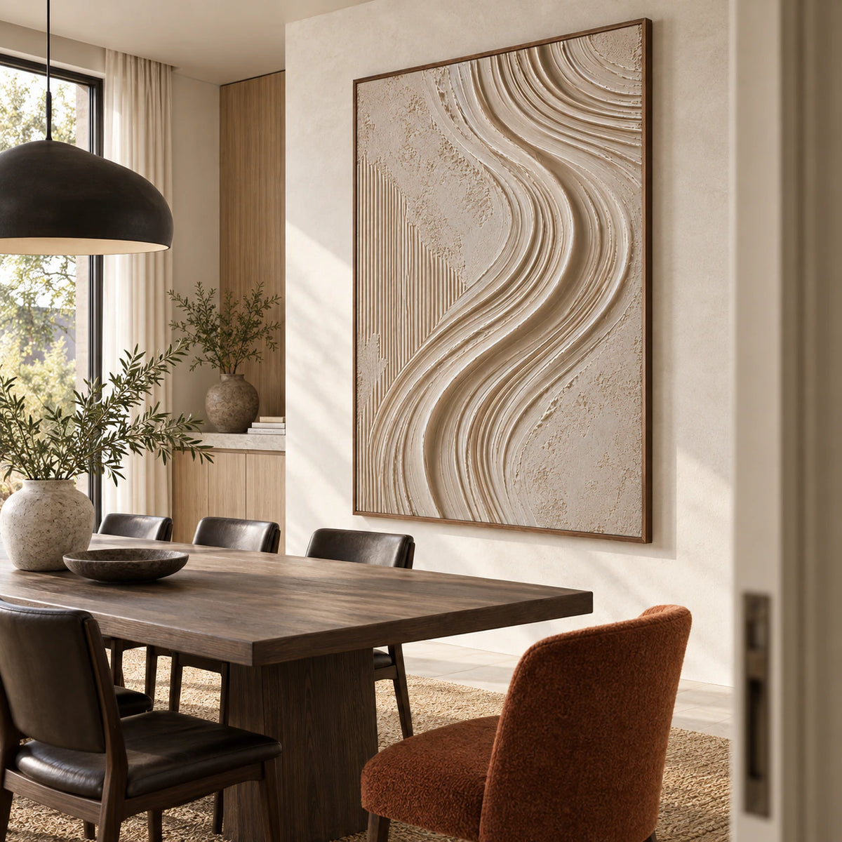 Vertical neutral textured abstract painting above a refined dining setting in natural daylight.