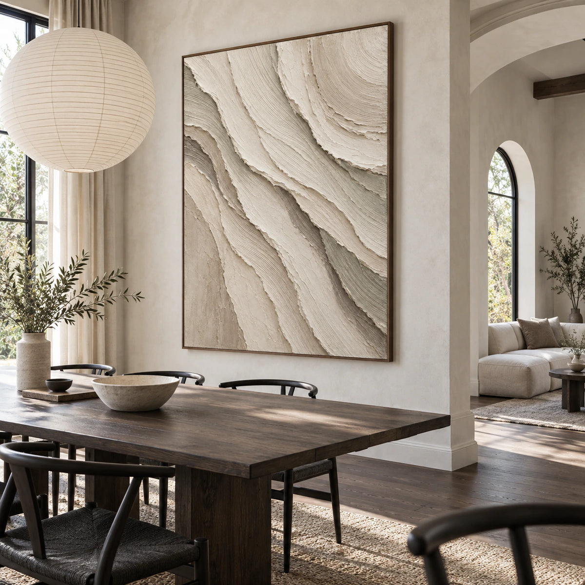 Refined dining room centered on the vertical ivory and greige textured relief artwork.