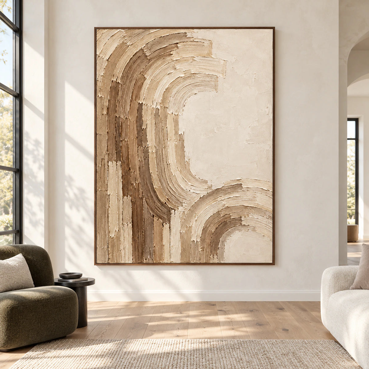 Large vertical cream and taupe abstract painting viewed straight-on in a spacious, sunlit architectural room with visible floor and restrained furniture.