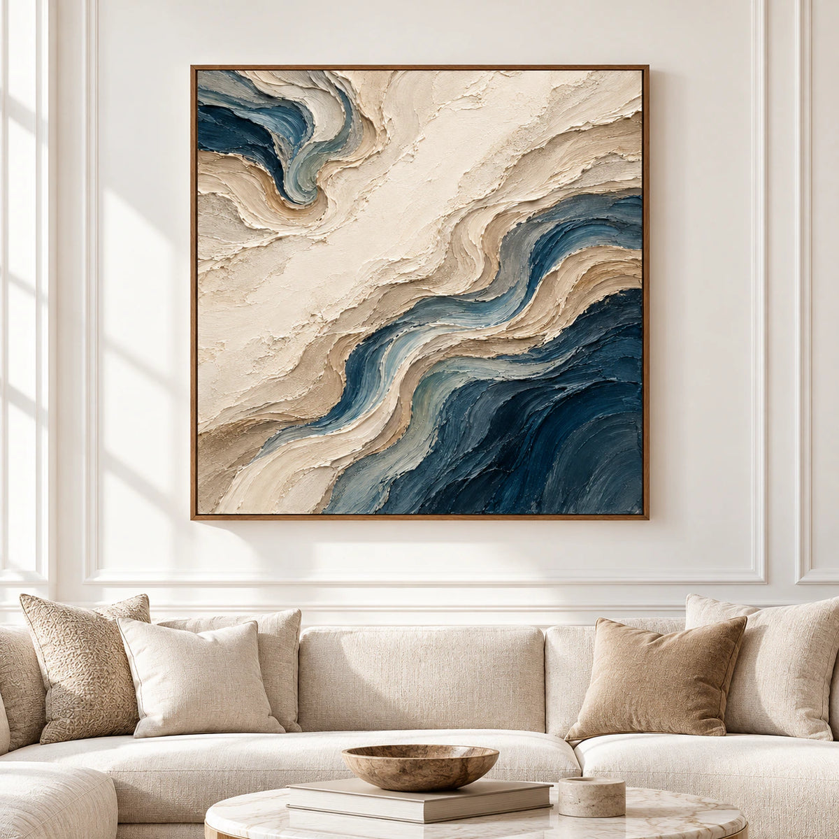 Large square abstract painting with flowing ivory and deep blue ridges displayed straight-on in a spacious, softly lit interior.