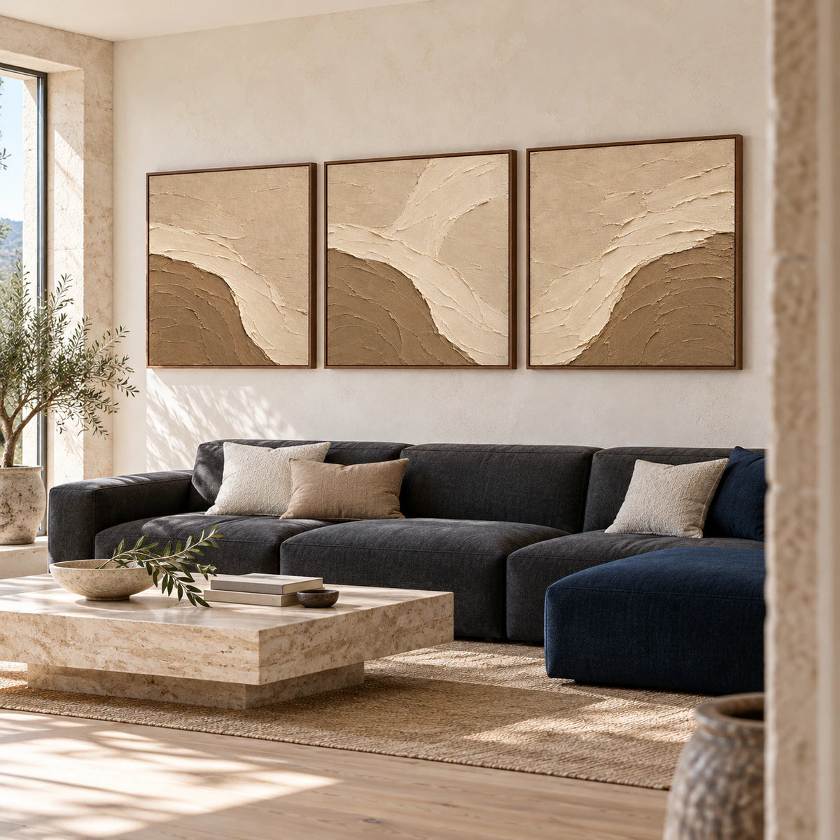 Dune-Estuary triptych displayed above a sofa in a bright living room.
