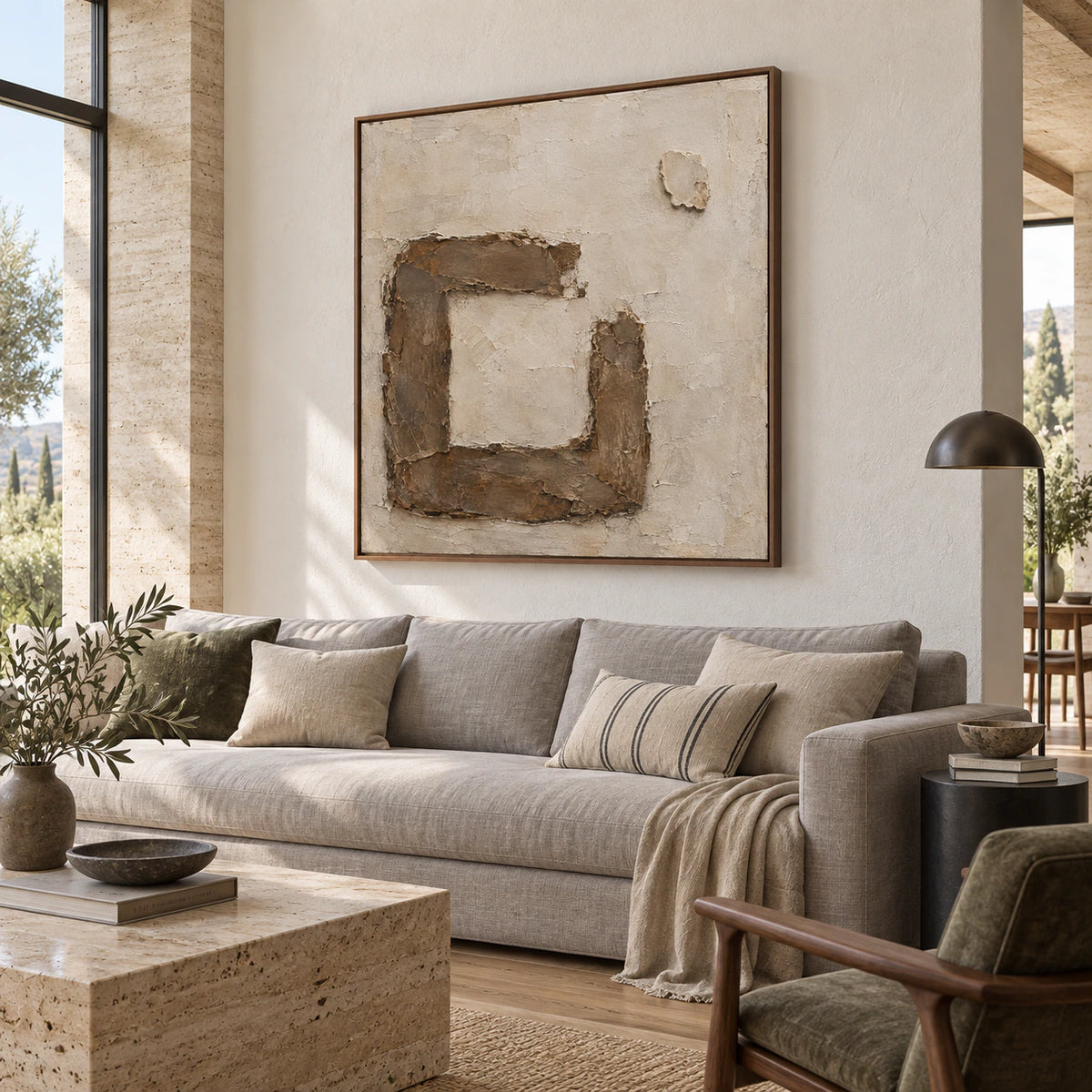 Earthen-Frame above a restrained sofa in a bright contemporary living room.