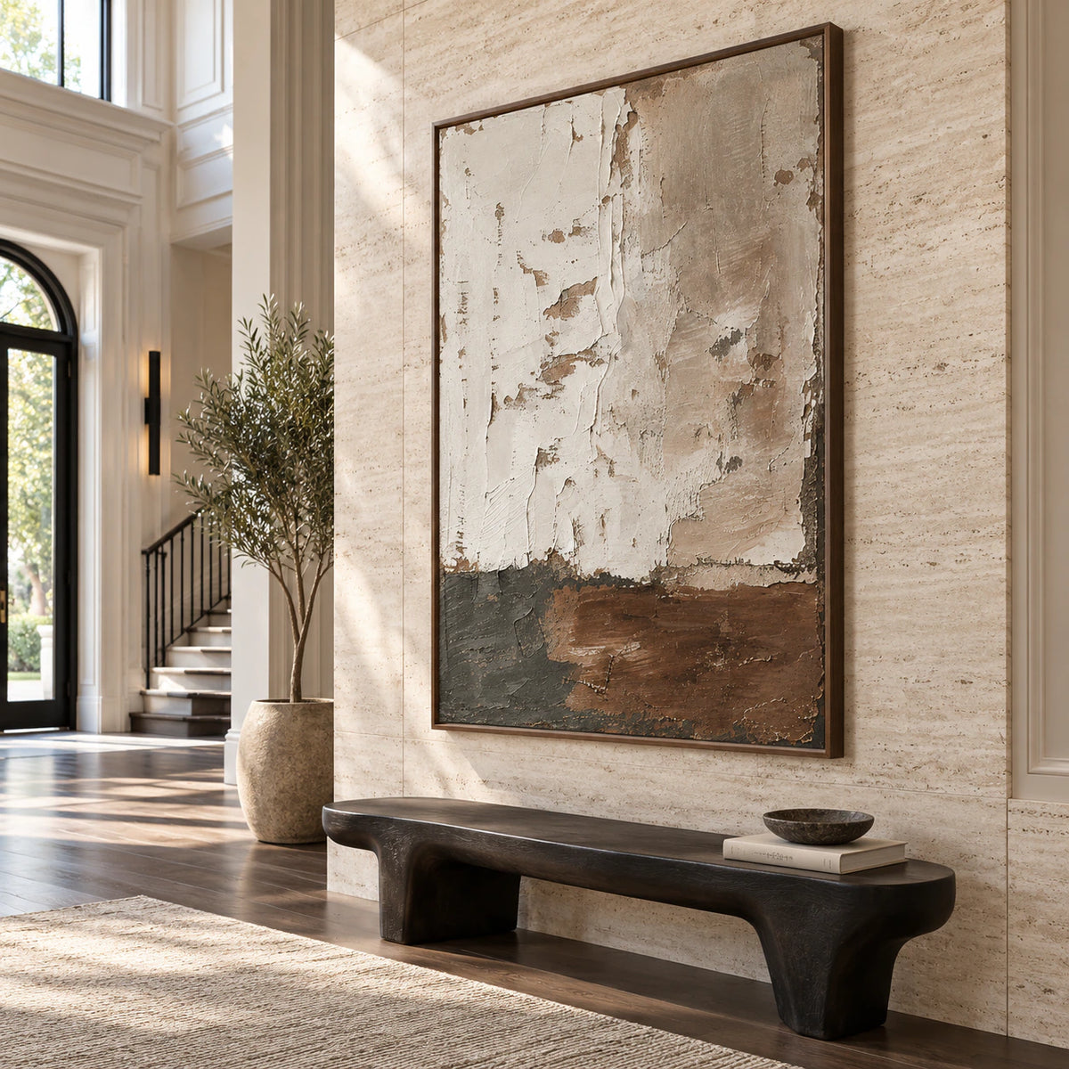 Large vertical textured abstract wall art in a gallery-scale foyer.