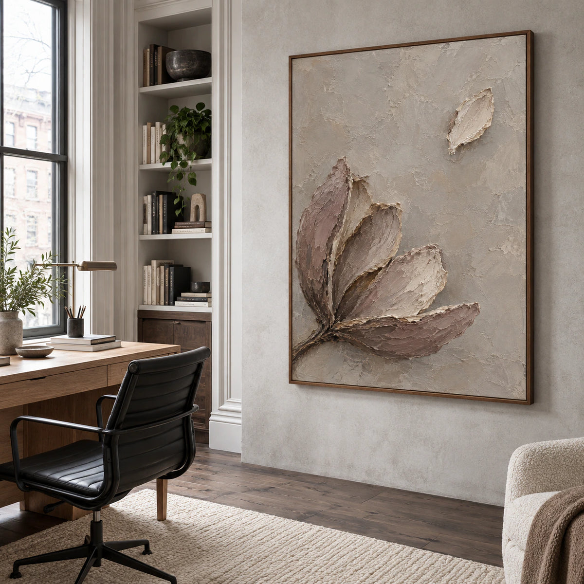 Large textured botanical artwork in an airy reading and home office space.