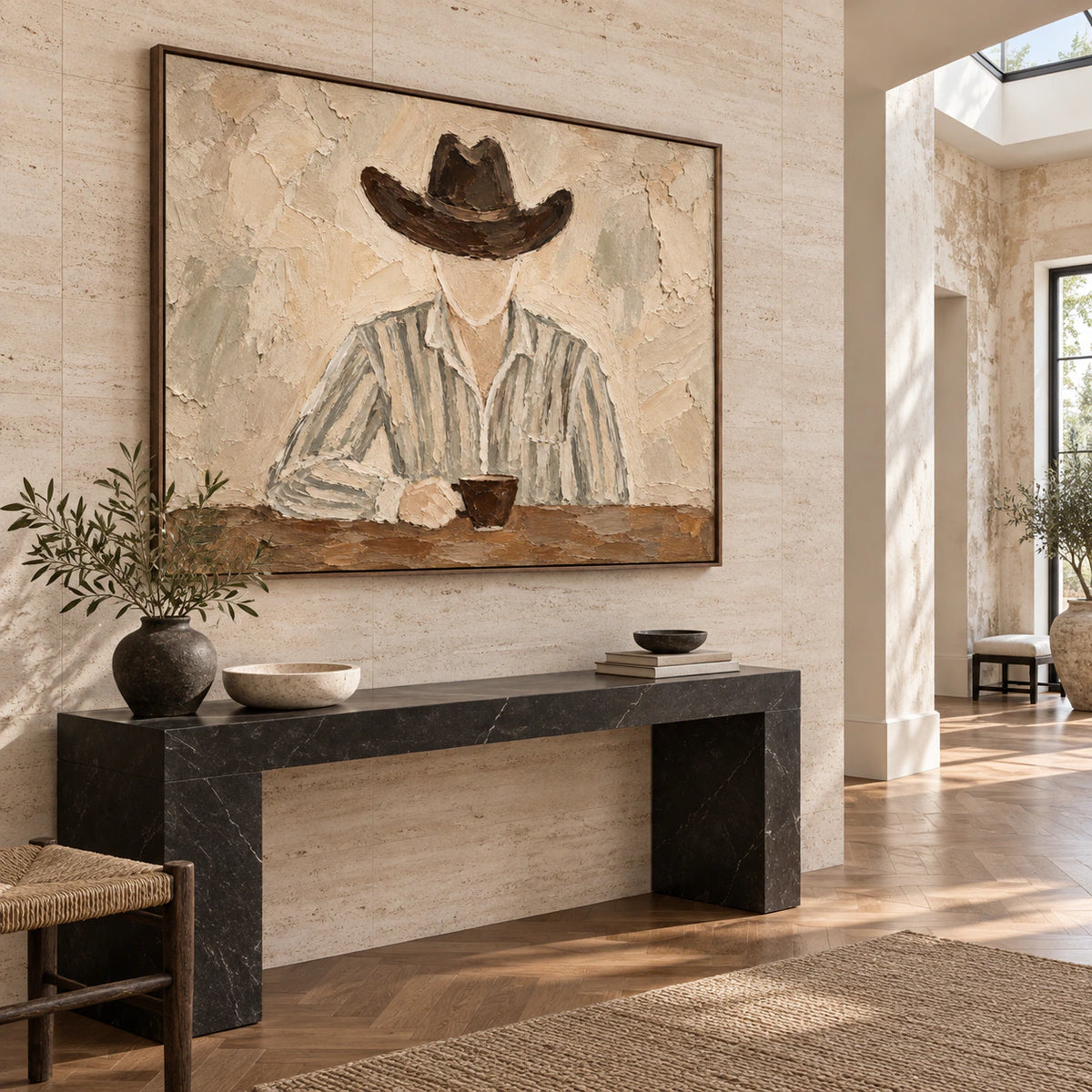 Large textured portrait displayed in a bright, gallery-scale foyer.