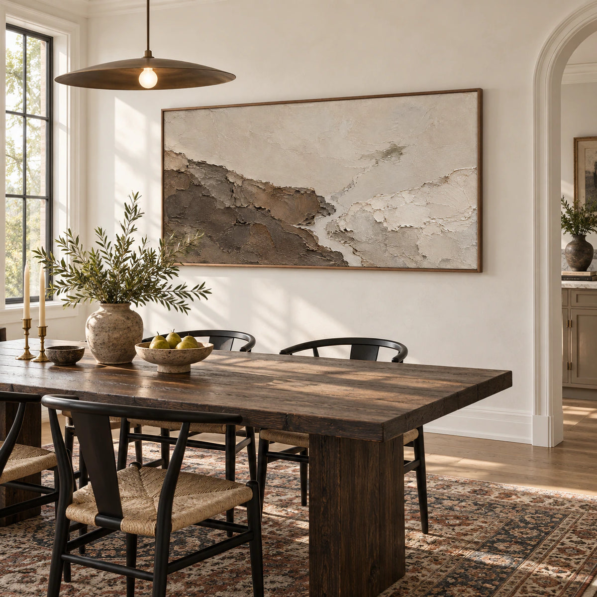 Earthen-Ridge anchoring a refined dining room with daylight and sculptural furnishings.