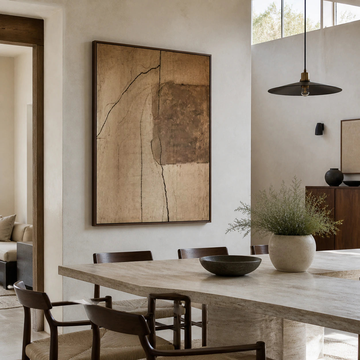 Vertical textured abstract painting in a refined daylight dining room.