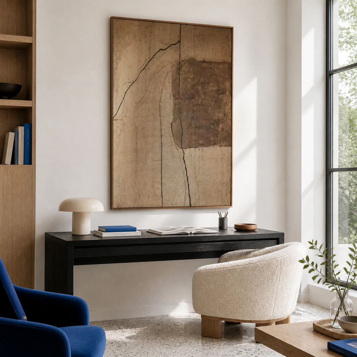 Vertical abstract painting in an airy home office reading space.