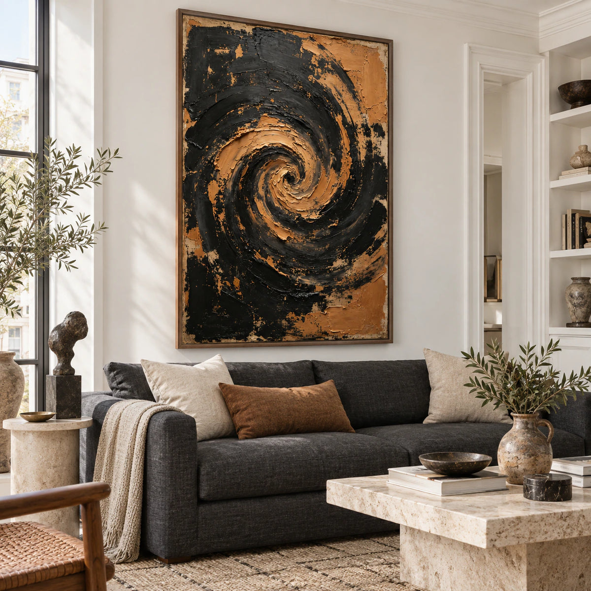 Large vertical black and ochre spiral painting above a neutral sofa in a bright contemporary living room.