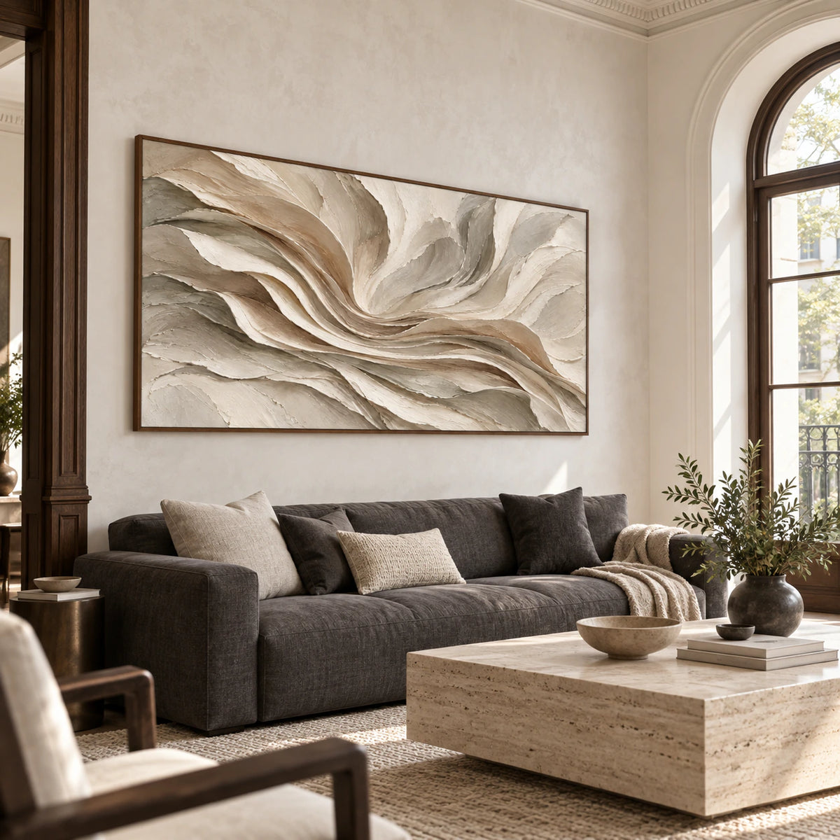 Large horizontal textured abstract painting above a restrained sofa in a bright living room.