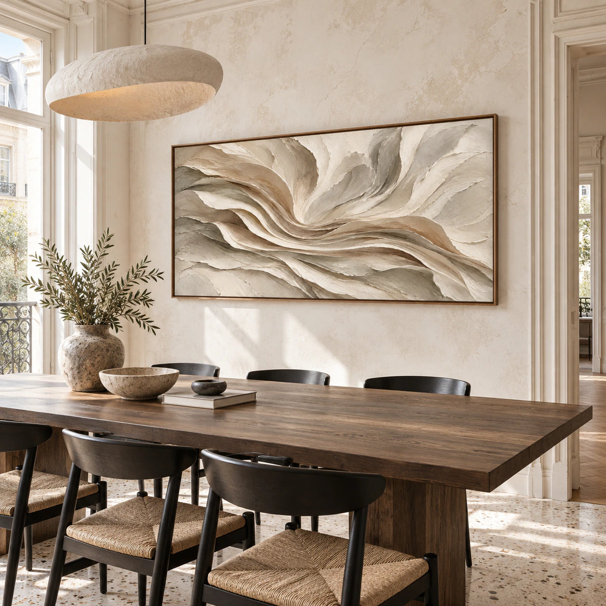 Large ivory and taupe abstract painting in a refined daylight dining room.