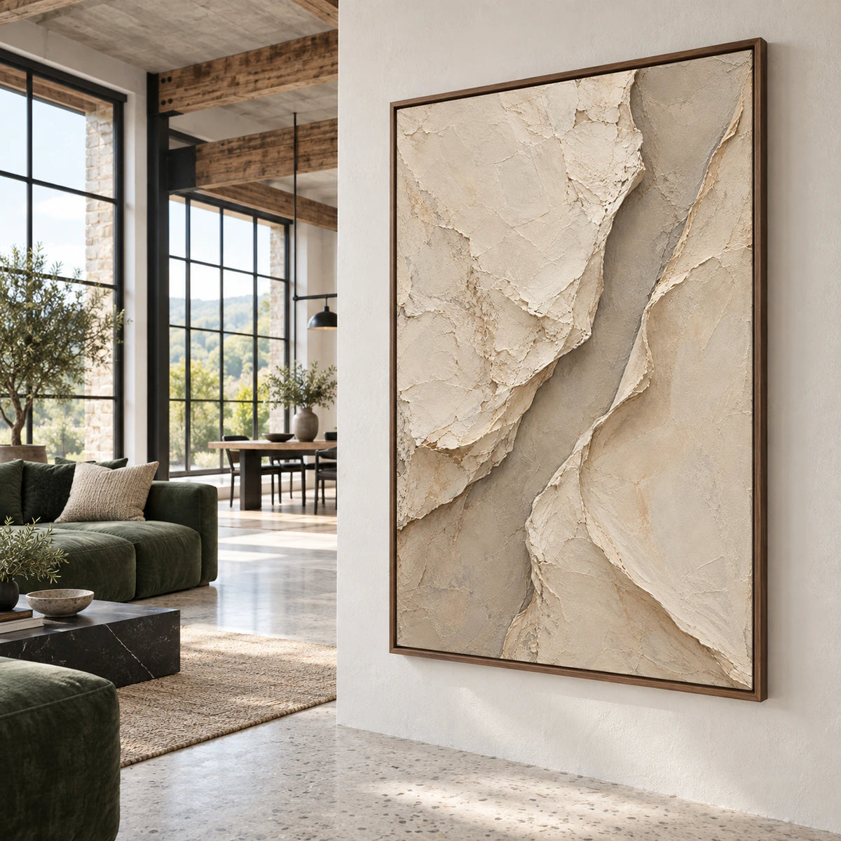 Large neutral relief artwork as the central subject in an expansive daylight loft interior.