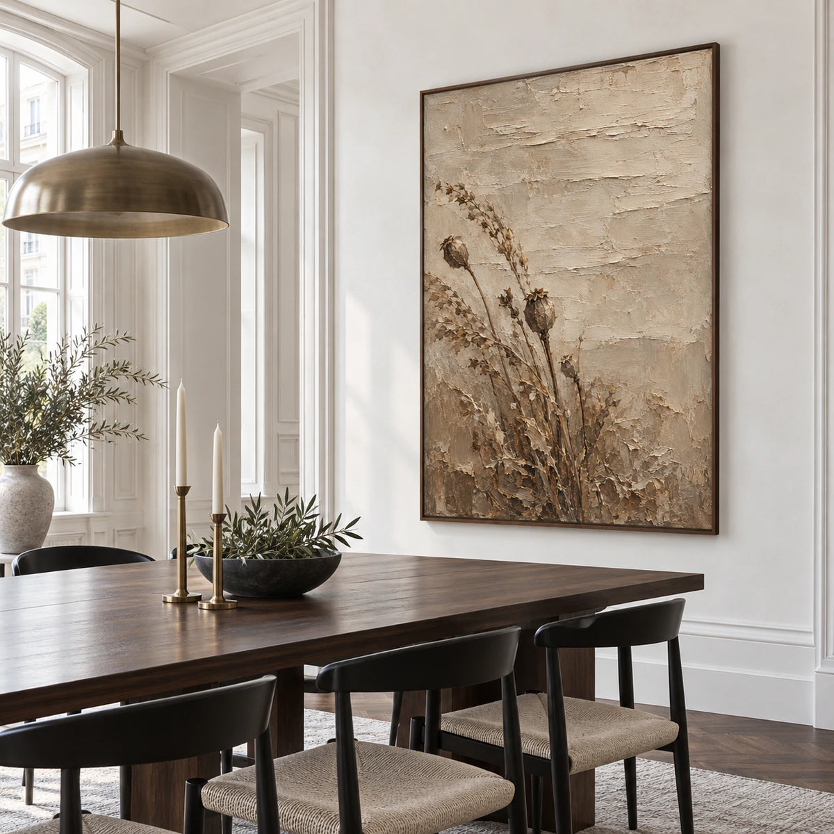 Vertical dried poppy artwork in a refined daylight dining room with sculptural furnishings.