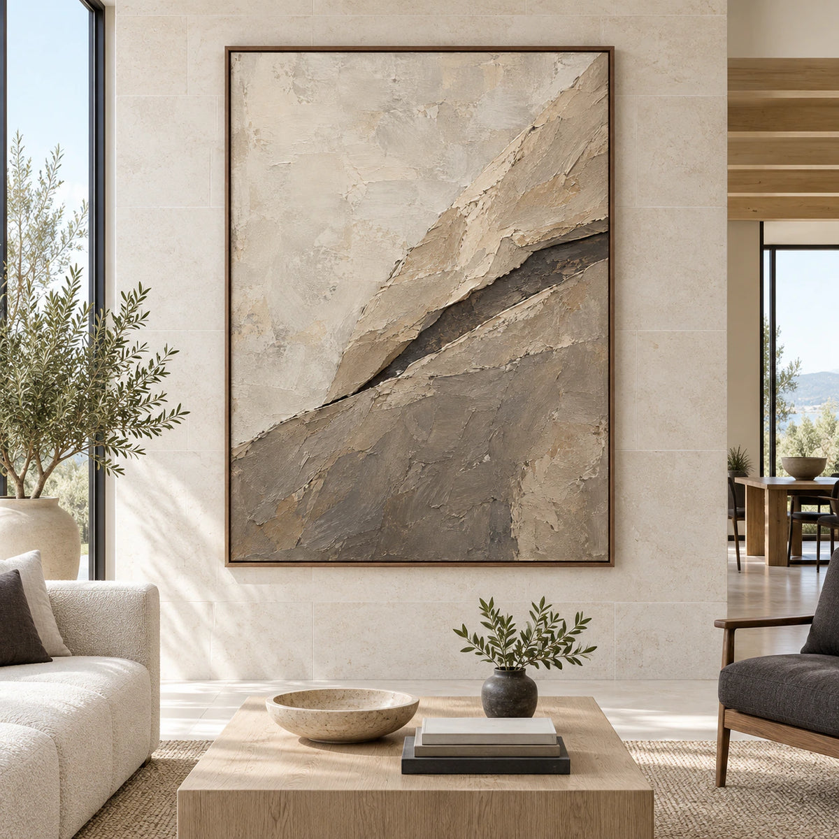Large vertical ivory, taupe and charcoal textured abstract painting displayed straight-on in a spacious daylight-filled interior.