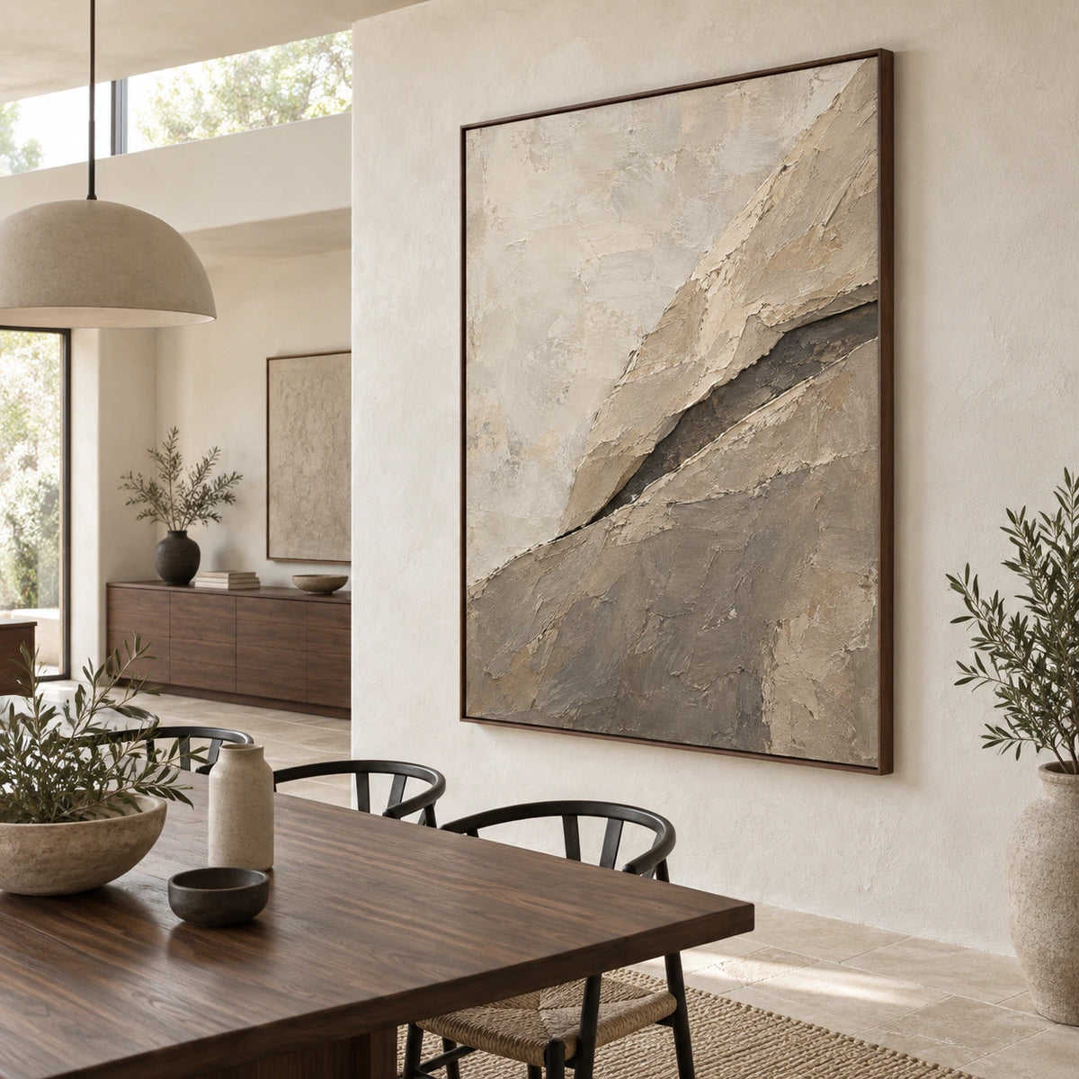 Large vertical textured abstract painting in a refined daylight dining room.