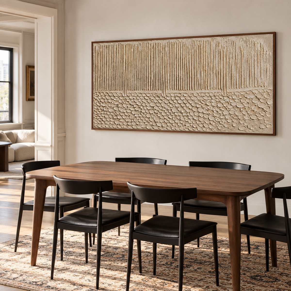 Fluted-Cairn anchoring a refined dining room with a dark wood table and pale stone walls.