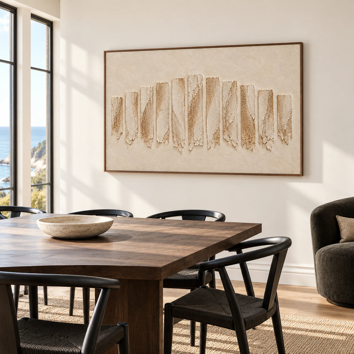 Ivory textured painting on a warm-white dining room wall above a dark oak table and sculptural black chairs, with tall windows, viewed from the right.