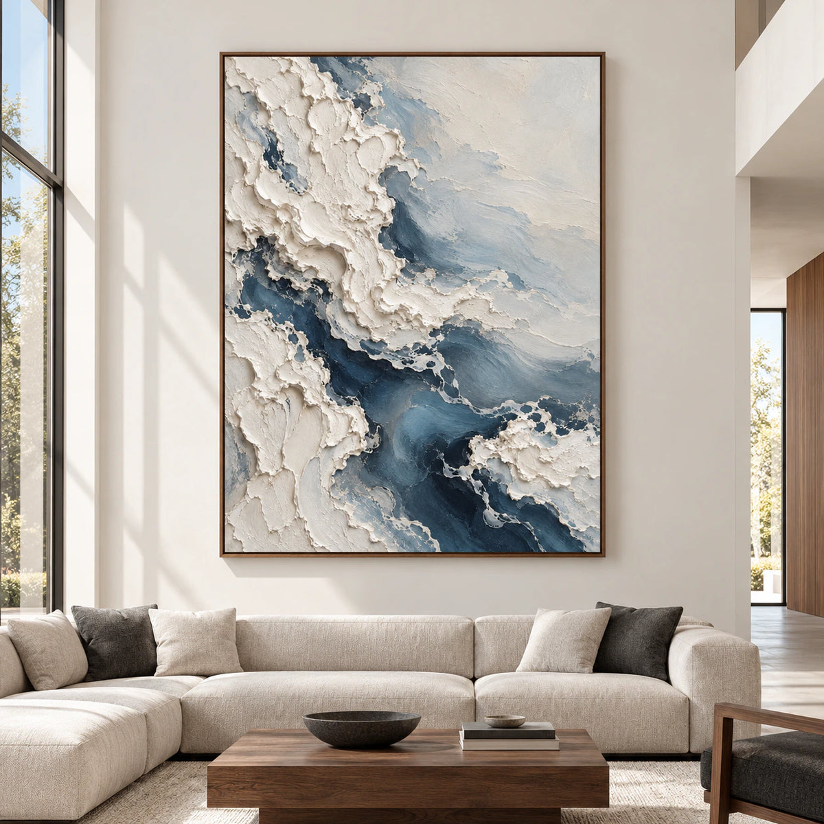 Large-scale vertical painting of ivory ridges and slate-blue currents displayed straight-on in a bright, spacious modern gallery living room.