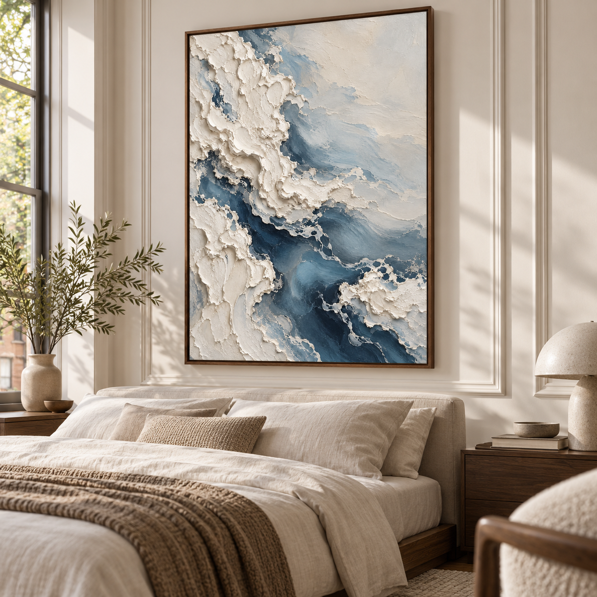 The textured vertical painting hangs above a low bed in a quiet, bright bedroom with linen bedding and soft natural light.