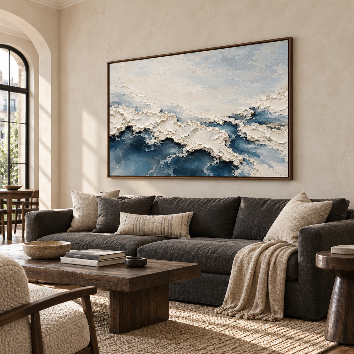 Foam Traverse commands a bright living room above a charcoal sofa, with daylight revealing its ivory ridges and slate-blue forms.