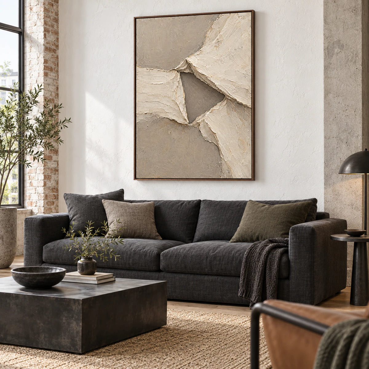 Folded-Quiet above a sculptural sofa in a bright daylight-filled living room.
