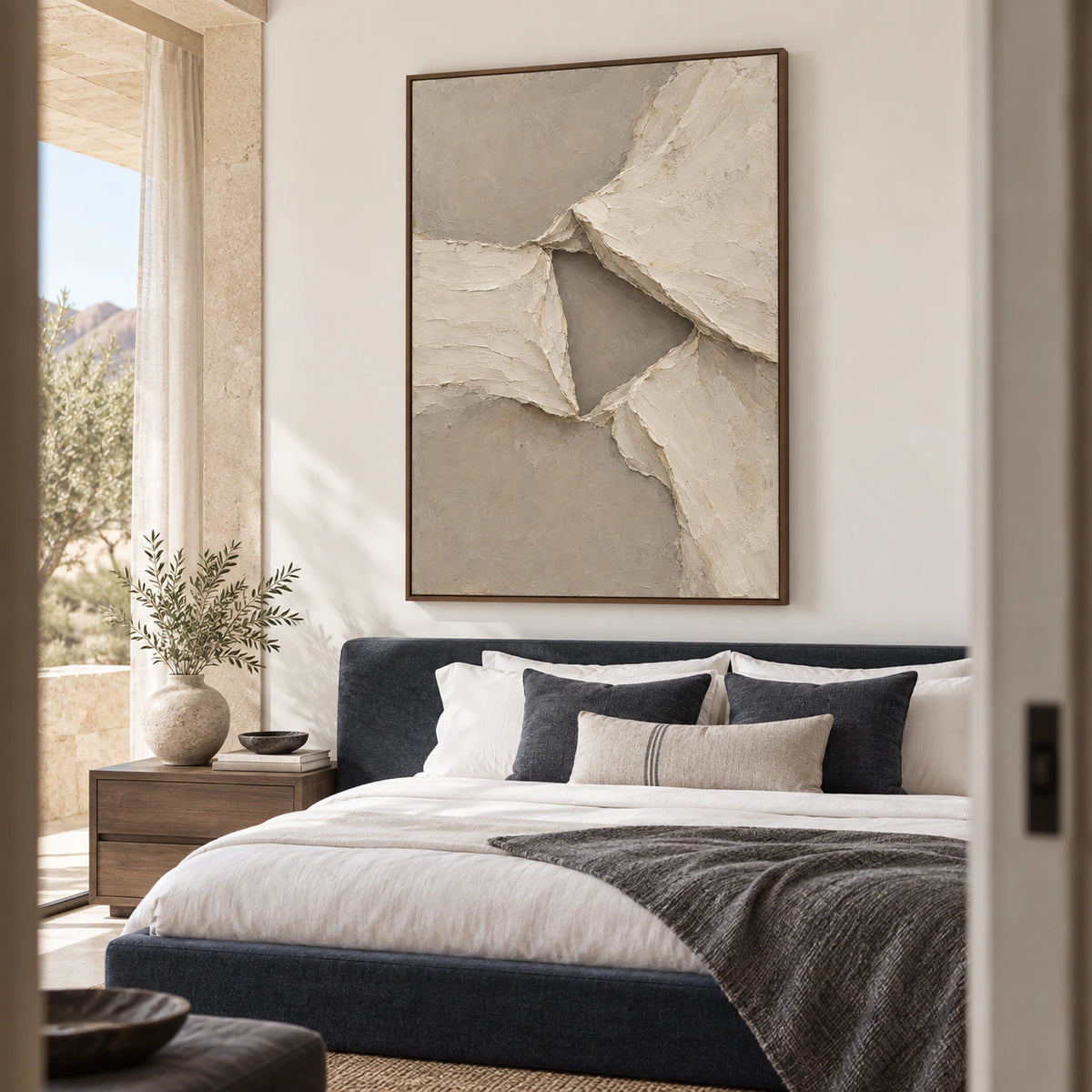 Folded-Quiet above a low bed in a quiet, softly lit bedroom.